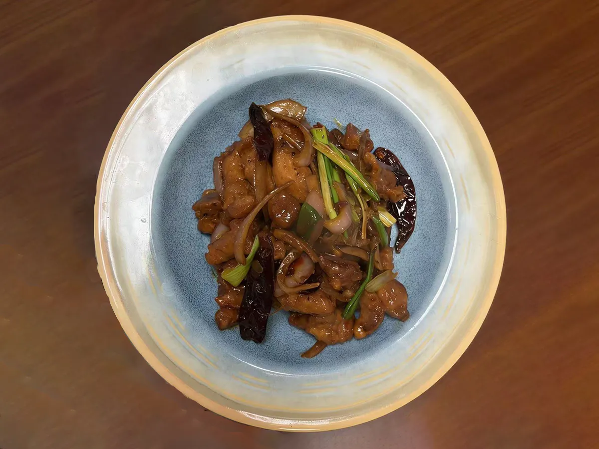 Stir-fried meat with spicy chilies and fragrant scallions at Dumpling House, an Asian Restaurant in Harrisonburg